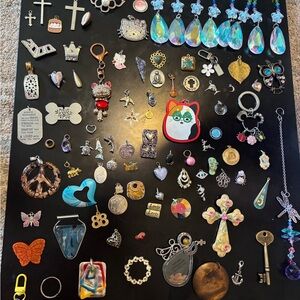 Roughly 100ct of assorted Jewelry Charms, keychains ,and pendants Collection